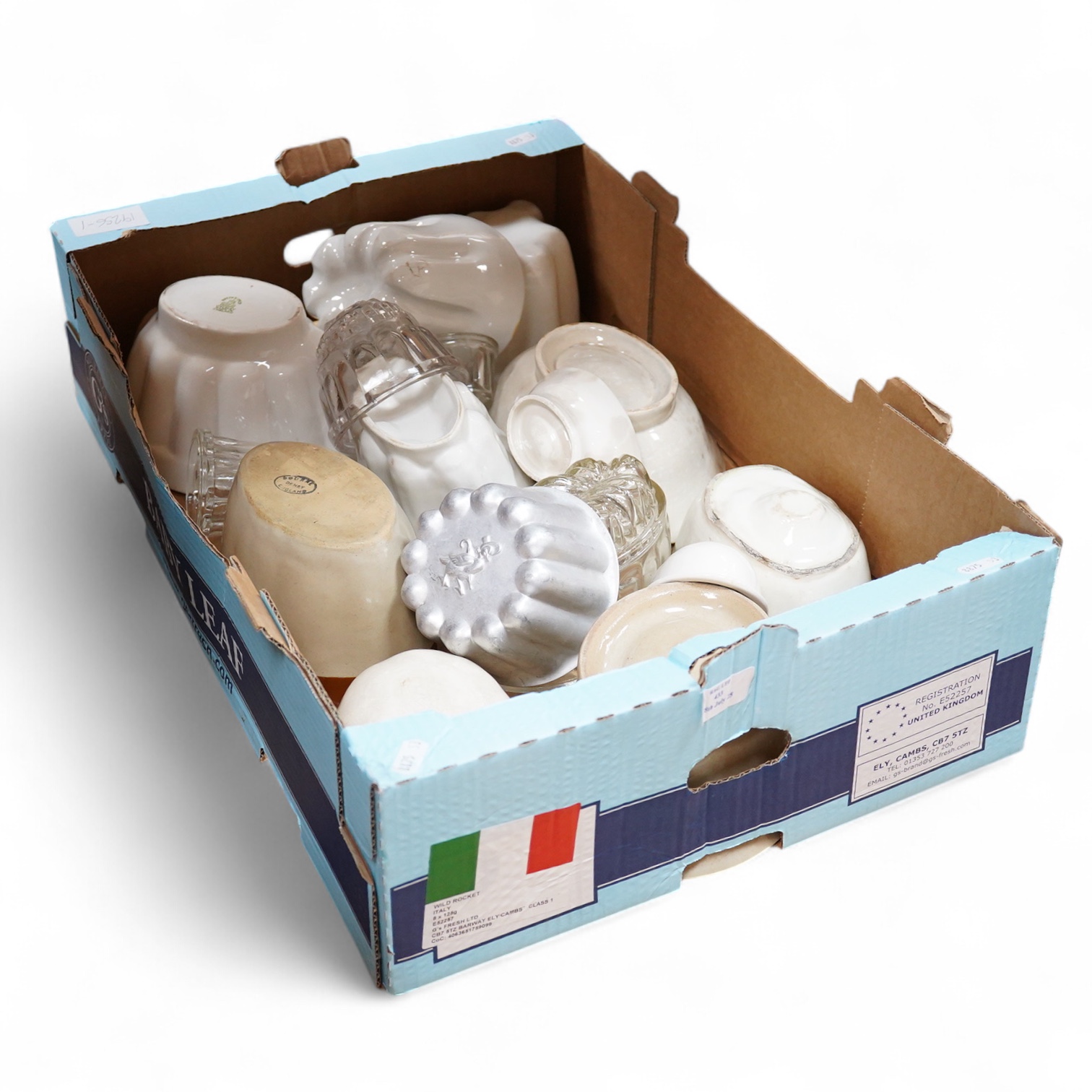 A collection of mostly Victorian ceramic and later glass and metal jelly moulds